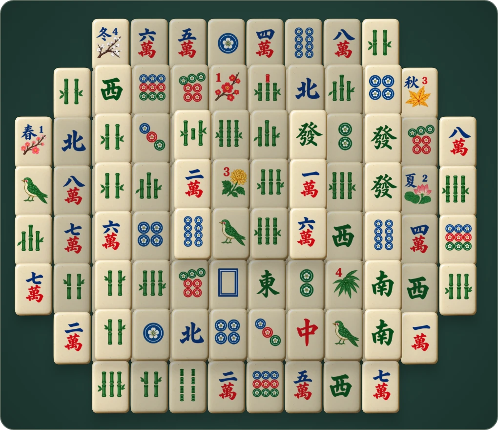 The playable Mahjong Solitaire board with original ivory, jade, coral and blue tiles in three layers