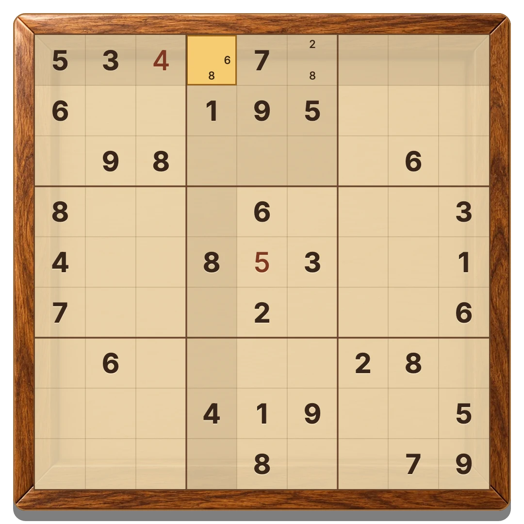 The playable wooden Sudoku board with dark starting numbers, terracotta entries and pencil notes in a nine by nine grid